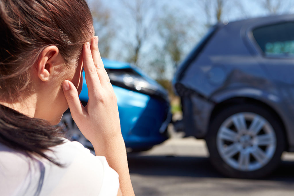woman at car wreck
